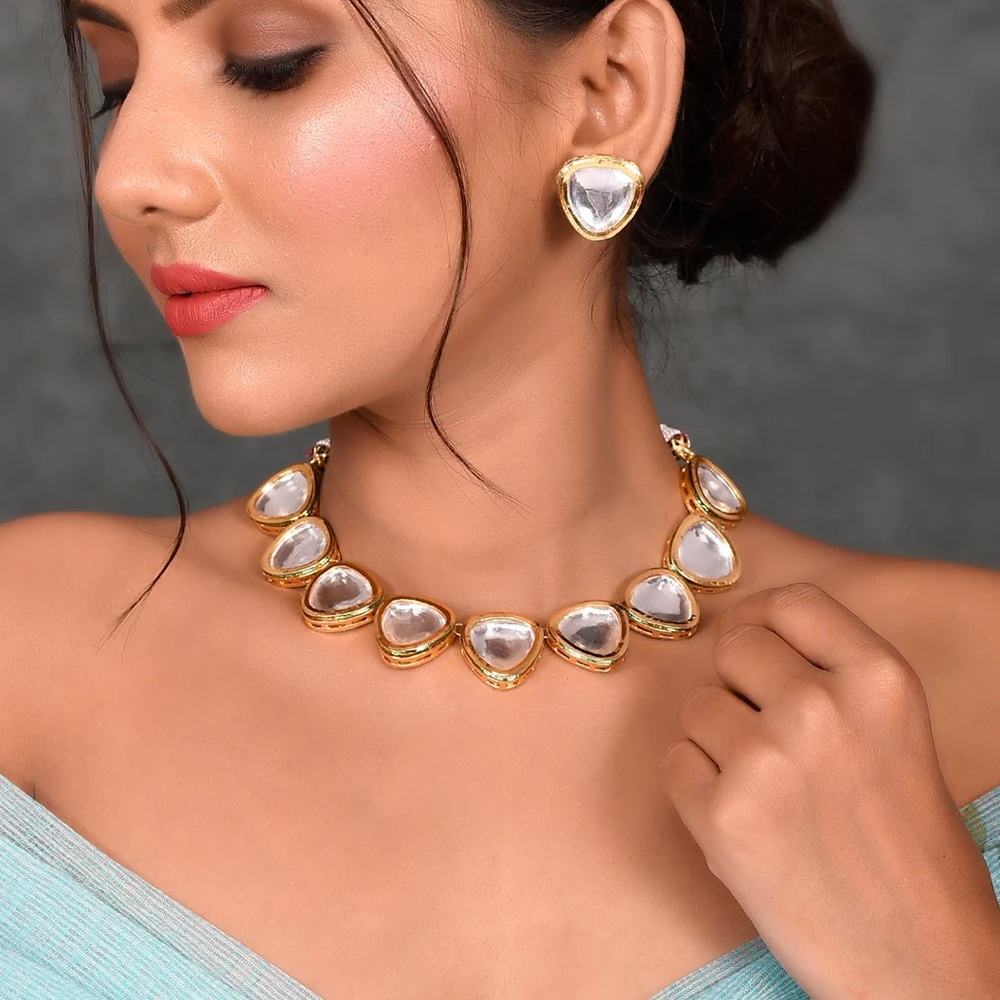 Gold plated white kundan studded set